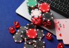Maine online casino bill enters final stages Poker chips and cards sit on a laptop, representing online casino