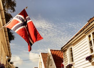 Norway’s regulator loses ‘several hundred’ public tips due to system error Norway flag on the side of a house