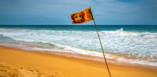 Sri Lankan officials question casino junket loopholes Sri Lanka flag waves on a beach