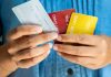 Swedish government plans expanded credit ban Man holds several credit cards, which they will no longer be used to gamble with in Sweden