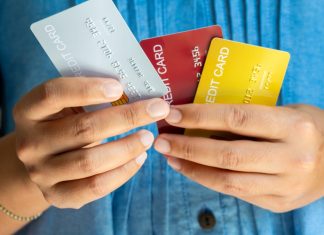 Swedish government plans expanded credit ban Man holds several credit cards, which they will no longer be used to gamble with in Sweden