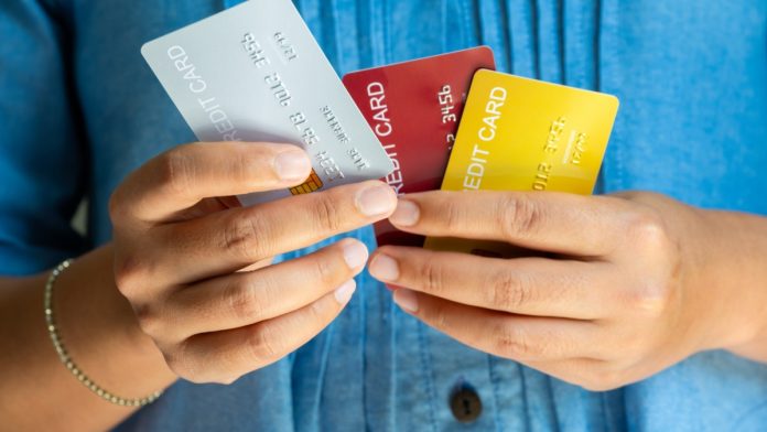 swedish-government-gambling-credit-ban Man holds several credit cards, which they will no longer be used to gamble with in Sweden