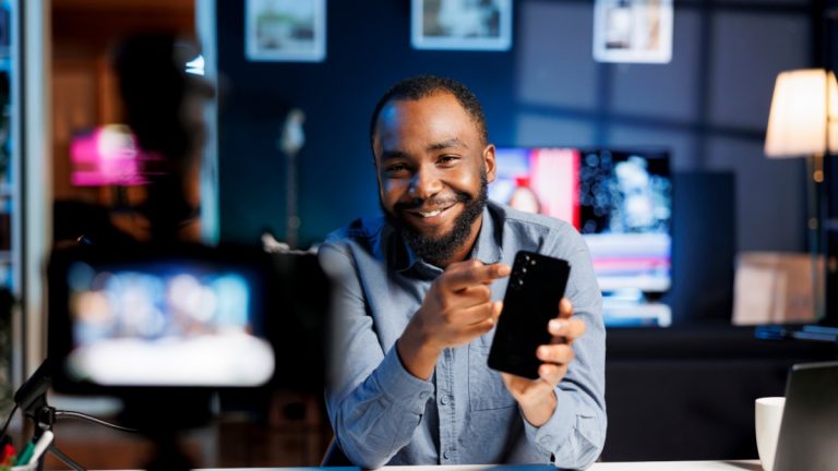 An influencer promotes something in front of a camera