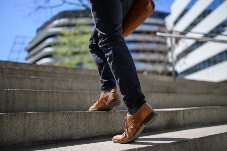 Businessman climbing steps