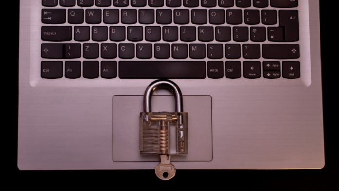 alea-continent-8-partnership A lock sits on a laptop, signifying cybersecurity