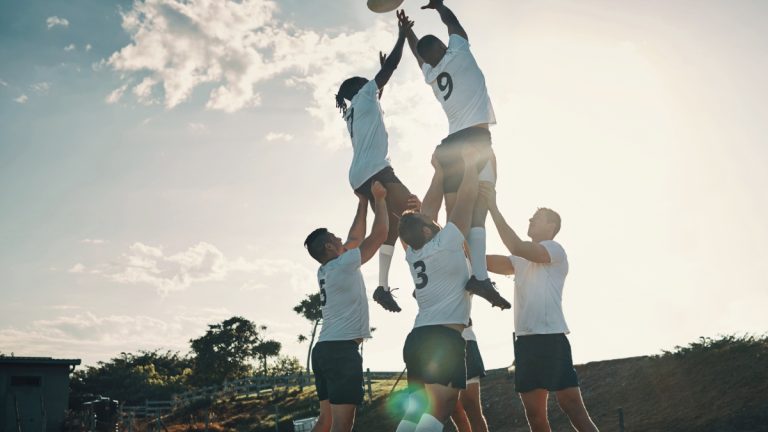 People being lifted in a rugby lineout