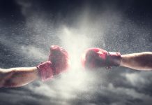 Anjouan Gambling Regulator rallies back as black market intensifies Two boxing gloves come together, indicating a fight