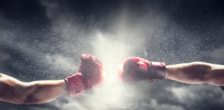 GGL’s new chair to continue black market fight Two boxing gloves come together, indicating a fight
