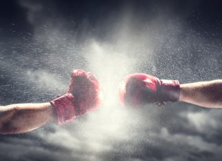 GGL’s new chair to continue black market fight Two boxing gloves come together, indicating a fight
