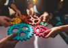 iGP strengthens iGaming Deck with BGaming integration Cogs being placed together