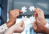 iGP bolsters iGaming Deck through Popiplay integration Puzzle pieces being brough together, showing an integration