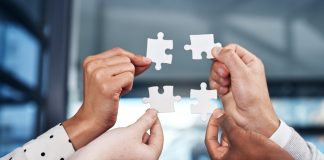 iGP bolsters iGaming Deck through Popiplay integration Puzzle pieces being brough together, showing an integration