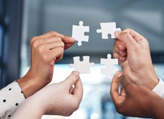 iGP bolsters iGaming Deck through Popiplay integration Puzzle pieces being brough together, showing an integration