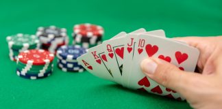 Playtech to lead FanDuel US poker evolution A poker hand showing a royal flush and poker chips