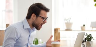 VGW shareholders angered by Laurence Escalante’s latest plans Angry man shouts at a computer