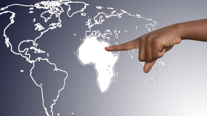 888-Africa-Christopher-Coyne Hand pointing to Africa