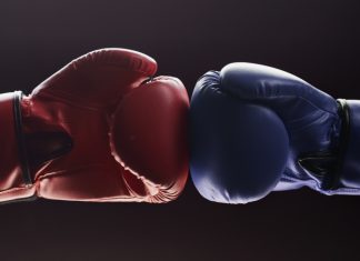 Behind the Gloves: how the fight game is fuelling change in iGaming Two boxing gloves