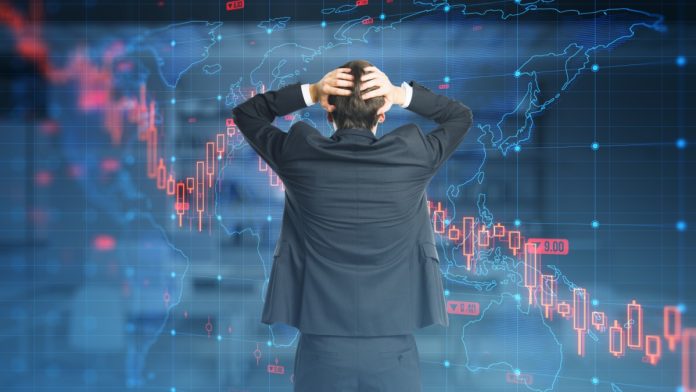 investor-unrest-skycity-240m-raise Man has head in hands looking at graph