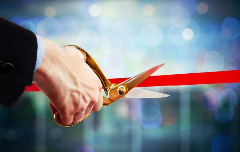 ribbon cutting to represent new online casino brand