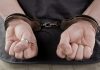 Thailand online gambling raid underscores black market strength Man with handcuffs behind his back