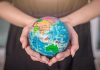 Eeze expands global presence through SpinOro partnership Womans hands hold a globe