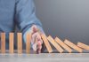 Italy gets tough on black market operators Hand blocks dominoes falling