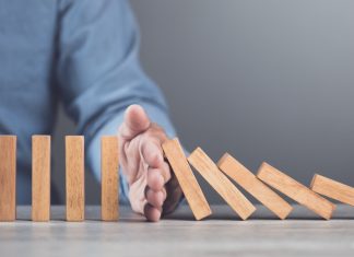 Italy gets tough on black market operators Hand blocks dominoes falling