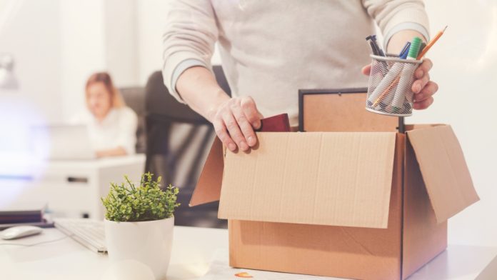 major-job-cuts-indias-online-gaming-ban man packing up cardboard box