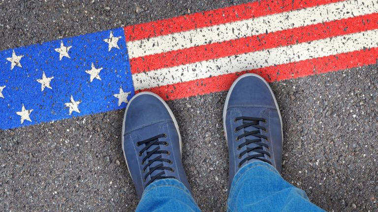 Person steps on US flag