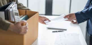 The details behind Ainsworth CEO’s dramatic resignation Person holds box of personal possessions as they leave their job