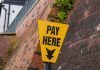 Dutch regulator elevates enforcement strategy after YouTuber fails to comply Pay here sign