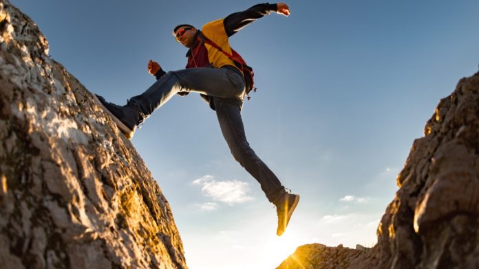 evolution-next-step-us-live-casino-journey Man taking big leap