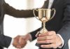 PAGCOR recognised for economic contributions as prohibition debate rages on Person handed trophy