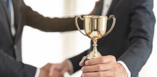 PAGCOR recognised for economic contributions as prohibition debate rages on Person handed trophy