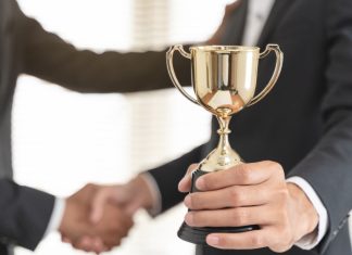 PAGCOR recognised for economic contributions as prohibition debate rages on Person handed trophy
