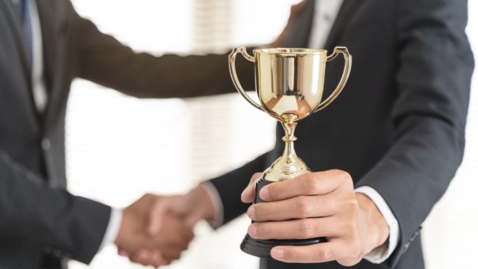 Person handed trophy