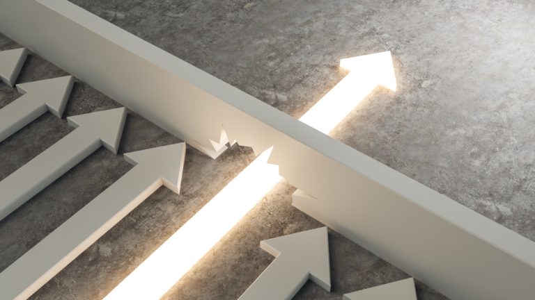 An arrow breaks through a wall, to picture Belatra's success.