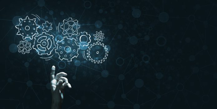 Vegangster AI A hand touches virtual gears, representing Vegangster using AI.