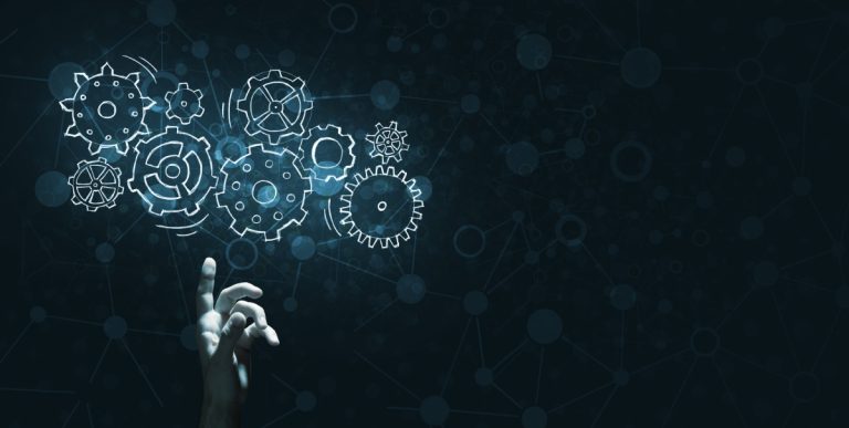 A hand touches virtual gears, representing Vegangster using AI.