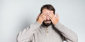 Labour MP says “nobody wants to see” gambling ads Man covers his eyes