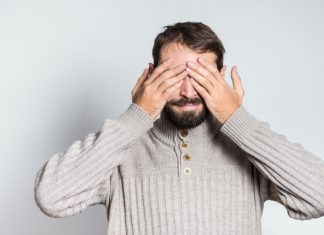 Labour MP says “nobody wants to see” gambling ads Man covers his eyes