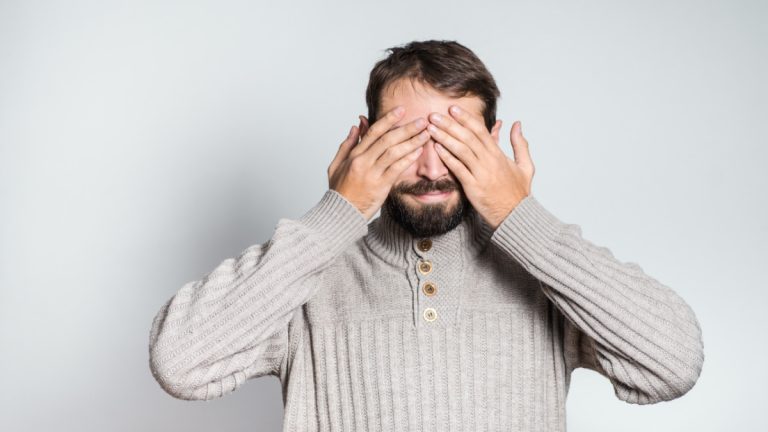 Labour MP says “nobody wants to see” gambling ads Man covers his eyes