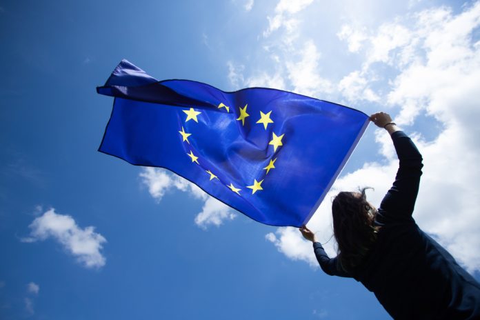 Woman holds EU flag