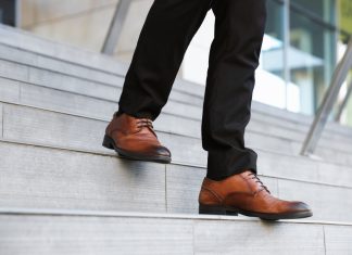 Steve McCann steps down as The Star CEO and Managing Director Businessman steps down stairs