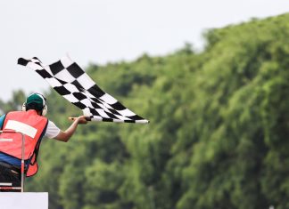 Hub88 gets the chequered flag with Solidicon integration Man waves chequered flag