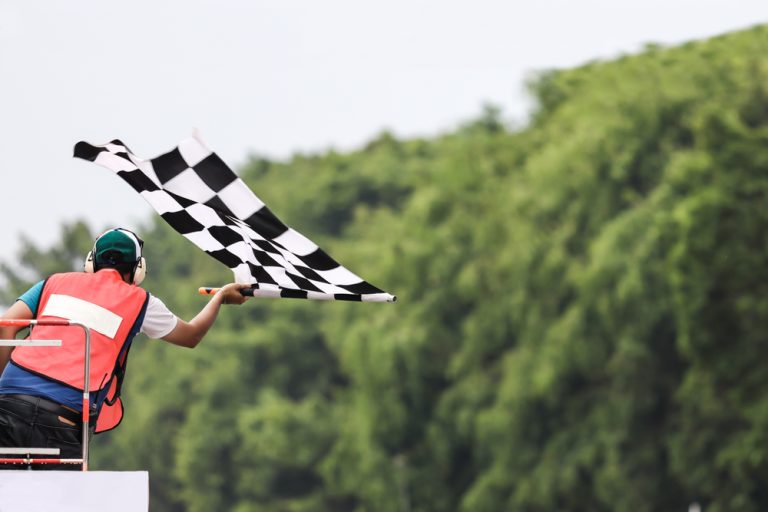 Hub88 gets the chequered flag with Solidicon integration Man waves chequered flag