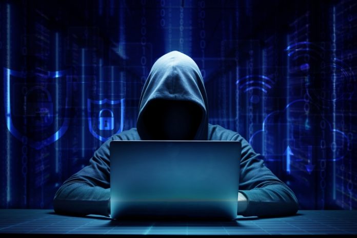 fraudster with hood up, highlighting the need for tools to stop bonus abuse