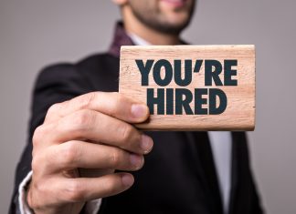 BetBlocker ‘enriched’ by Monica Shafaq appointment Businessman holds you're hired sign