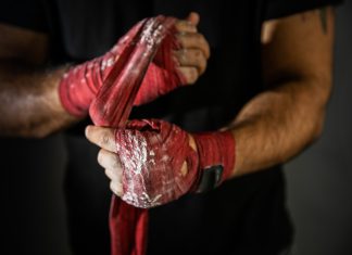 EveryMatrix deploys AI to join bonus abuse fight Hands being wrapped