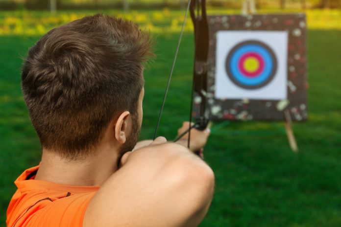 Brazil tax Man aims at archery target